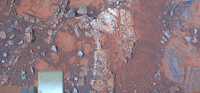 A false colour image taken by Mars Rover Opportunity of rocks which hold clues to a past watery Martian environment.