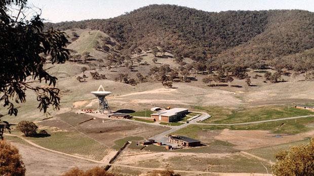 View of the complex from up on a hill showing the hills, buildings and Deep Space Station 42