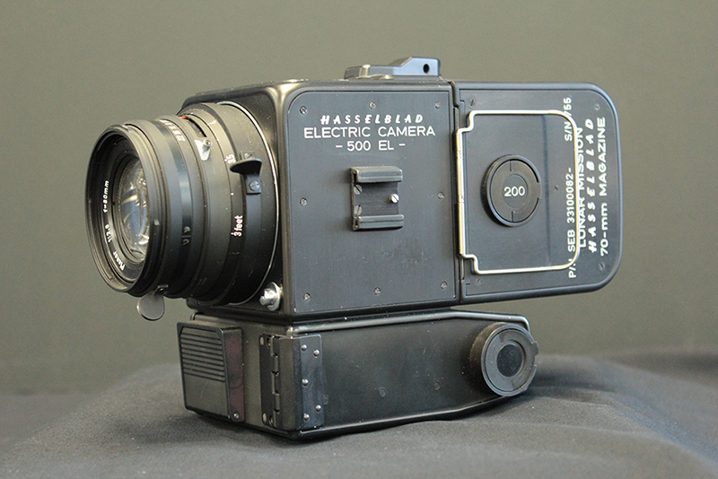 Old black and grey Hasselblad electric camera with a lens attached.